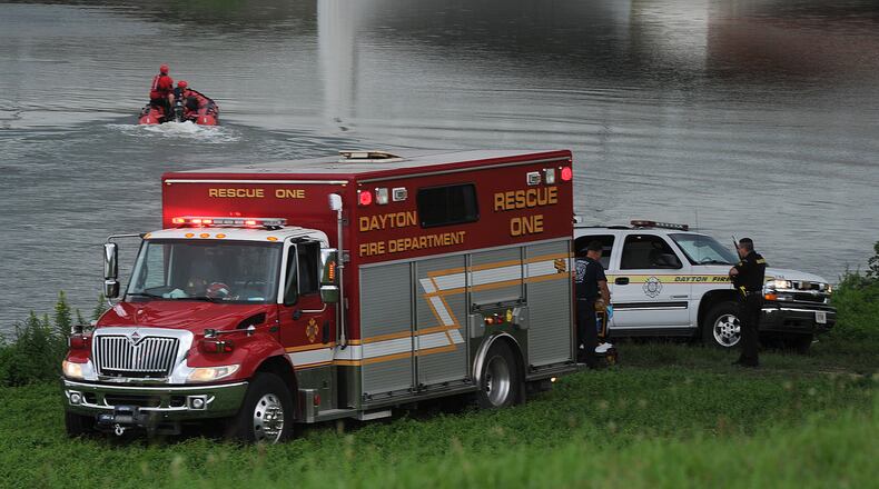 Members of the Dayton Fire Department rescued a woman from Great Miami river Thursday Aug. 4, 2022 near Washington Street. MARSHALL GORBY\STAFF