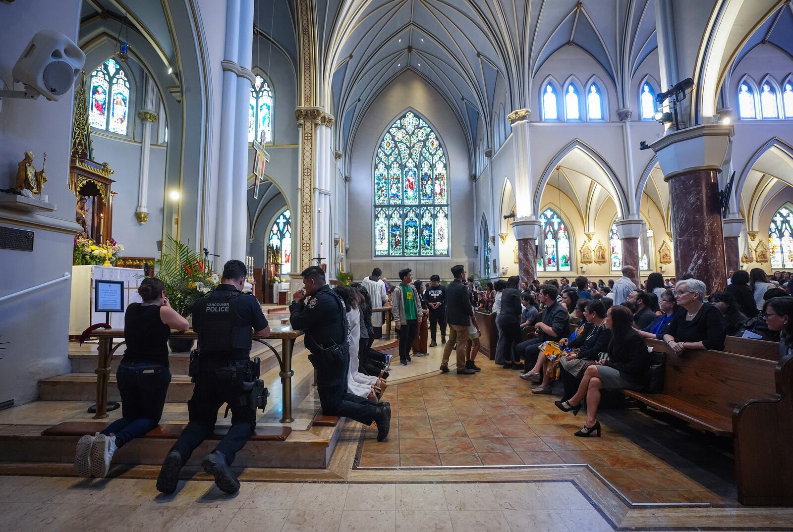 People attend mass at Holy Rosary Cathedral on a provincial day of mourning for the victims of the vehicle-ramming attack at the Filipino community's Lapu Lapu Day festival last week, in Vancouver, on Friday, May 2, 2025. (Darryl Dyck/The Canadian Press via AP)