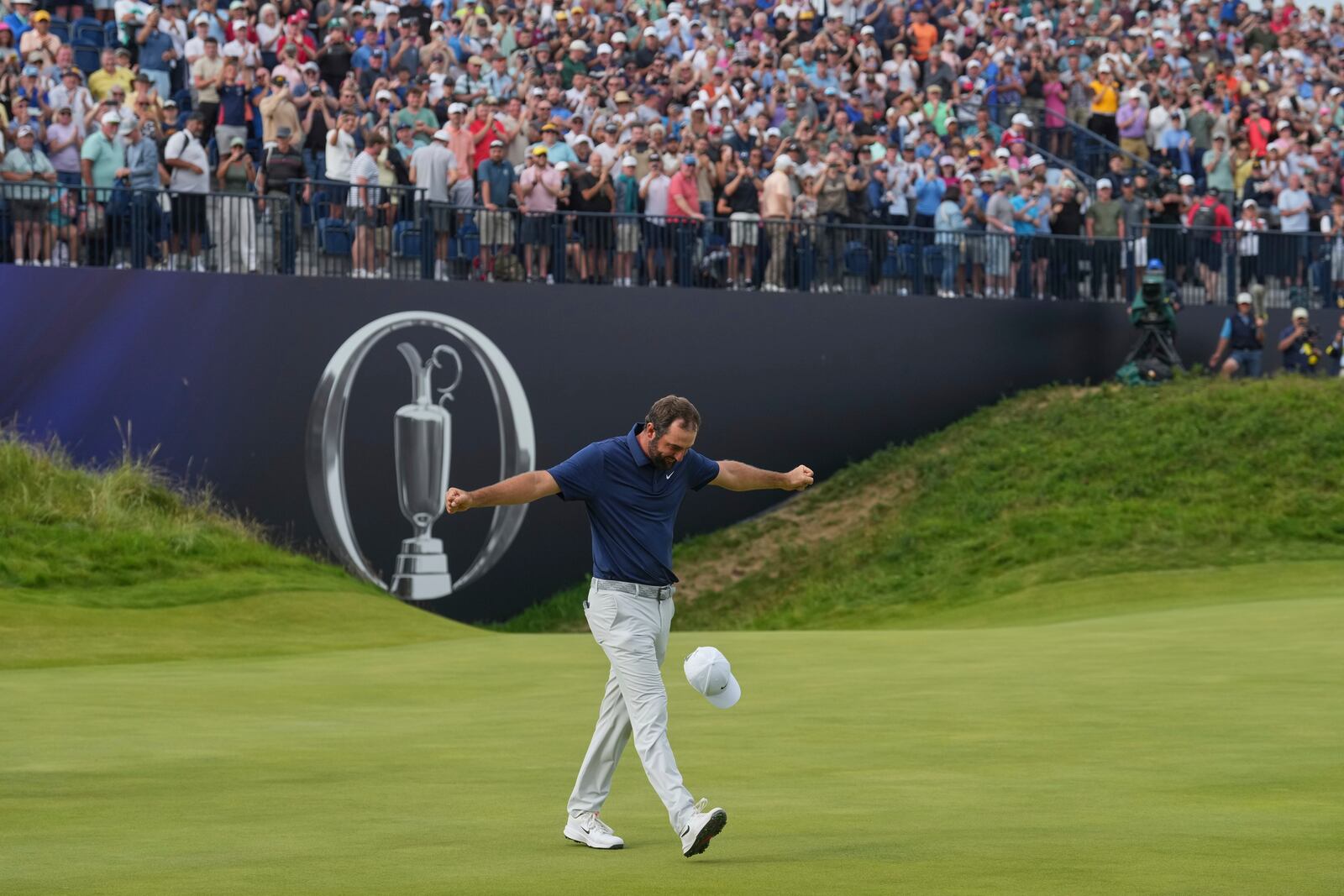 Scottie Scheffler of the United States celebrates after winning the British Open golf championship at the Royal Portrush Golf Club, Northern Ireland, Sunday, July 20, 2025. (AP Photo/Jon Super)