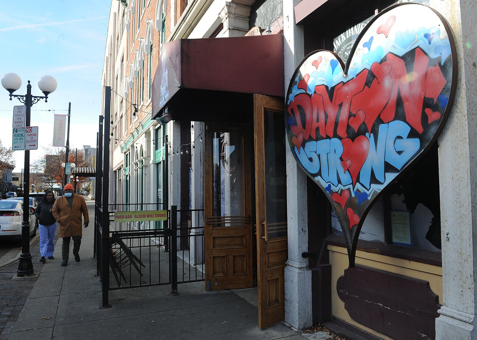 The FBI and Dayton police announced Monday, Nov. 29, 2021, they closed the 26-month investigation into the Aug. 4, 2019, Oregon District mass shooting. A Dayton Strong sign still stands in front of Ned Peppers Bar, near where the fatal shooting took place. MARSHALL GORBY\STAFF