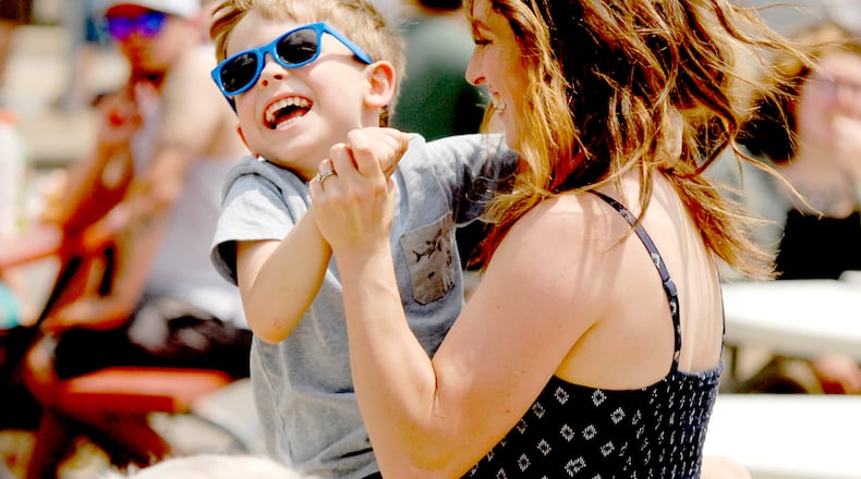 Festive fun at the Troy Strawberry Festival, which returns June 1-2 in Troy. DAVID A. MOODIE/CONTRIBUTING PHOTOGRAPHER