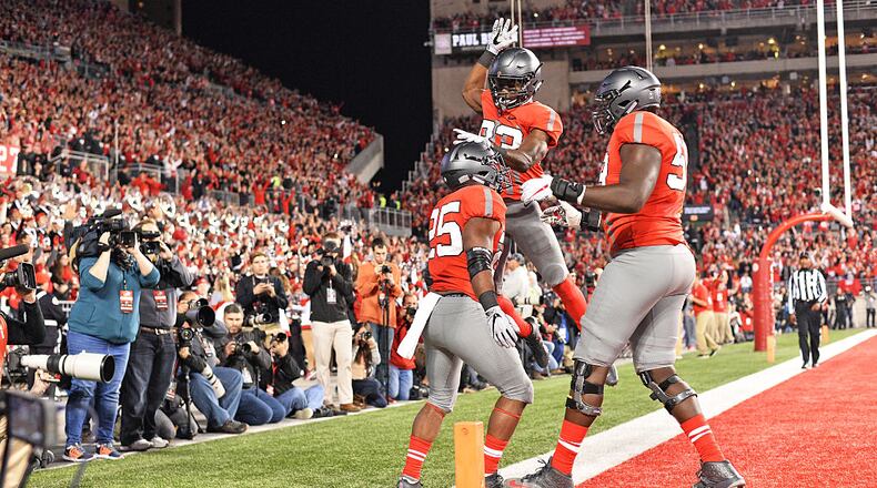 COLUMBUS, OH - NOVEMBER 5: Mike Weber #25 of the Ohio State Buckeyes celebrates with Terry McLaurin #83 of the Ohio State Buckeyes and Isaiah Prince #59 of the Ohio State Buckeyes after scoring on a 23-yard touchdown run in the second quarter against the Nebraska Cornhuskers at Ohio Stadium on November 5, 2016 in Columbus, Ohio. (Photo by Jamie Sabau/Getty Images)