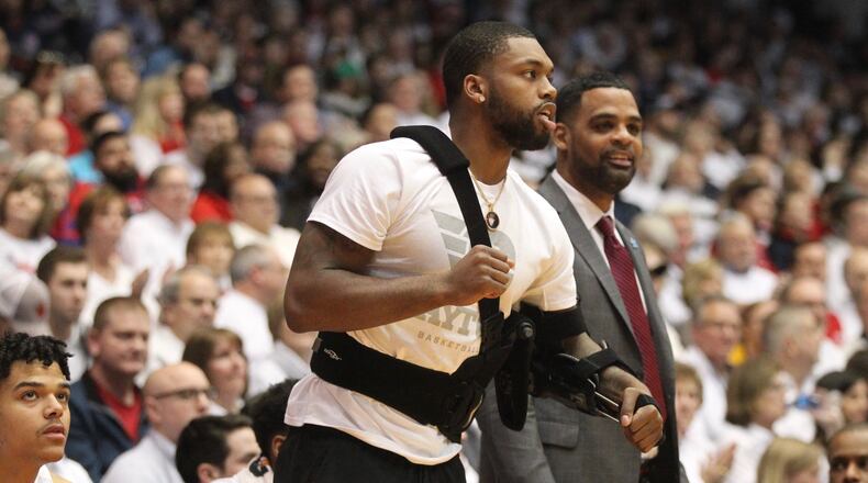 Dayton’s Trey Landers watches from the bench during a game against Virginia Commonwealth on Saturday, Feb. 16, 2019, at UD Arena. David Jablonski/Staff