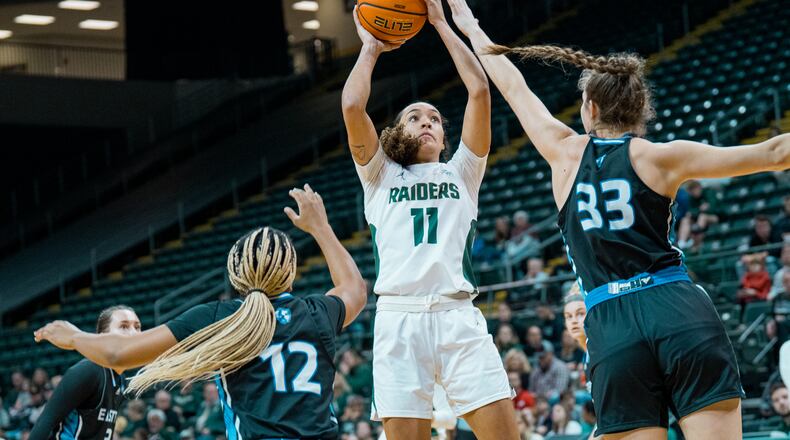 Wright State's Rachel Loobie (11) battles Eastern Illinois defenders Charita Lewis (12) and Macy McGlone inside during a game at the Nutter Center on Dec. 9, 2023. Wright State Athletics photo