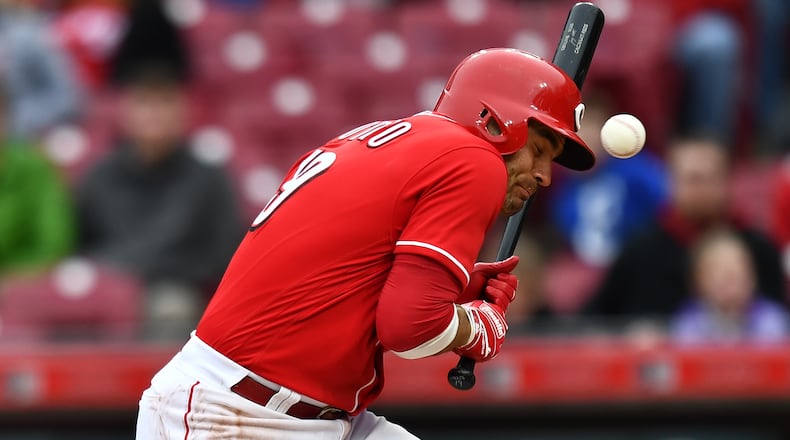 CINCINNATI, OH - APRIL 1:  Joey Votto #19 of the Cincinnati Reds is hit by a pitch to load the bases in the eighth inning against the Washington Nationals at Great American Ball Park on April 1, 2018 in Cincinnati, Ohio. Washington defeated Cincinnati 6-5.  (Photo by Jamie Sabau/Getty Images)