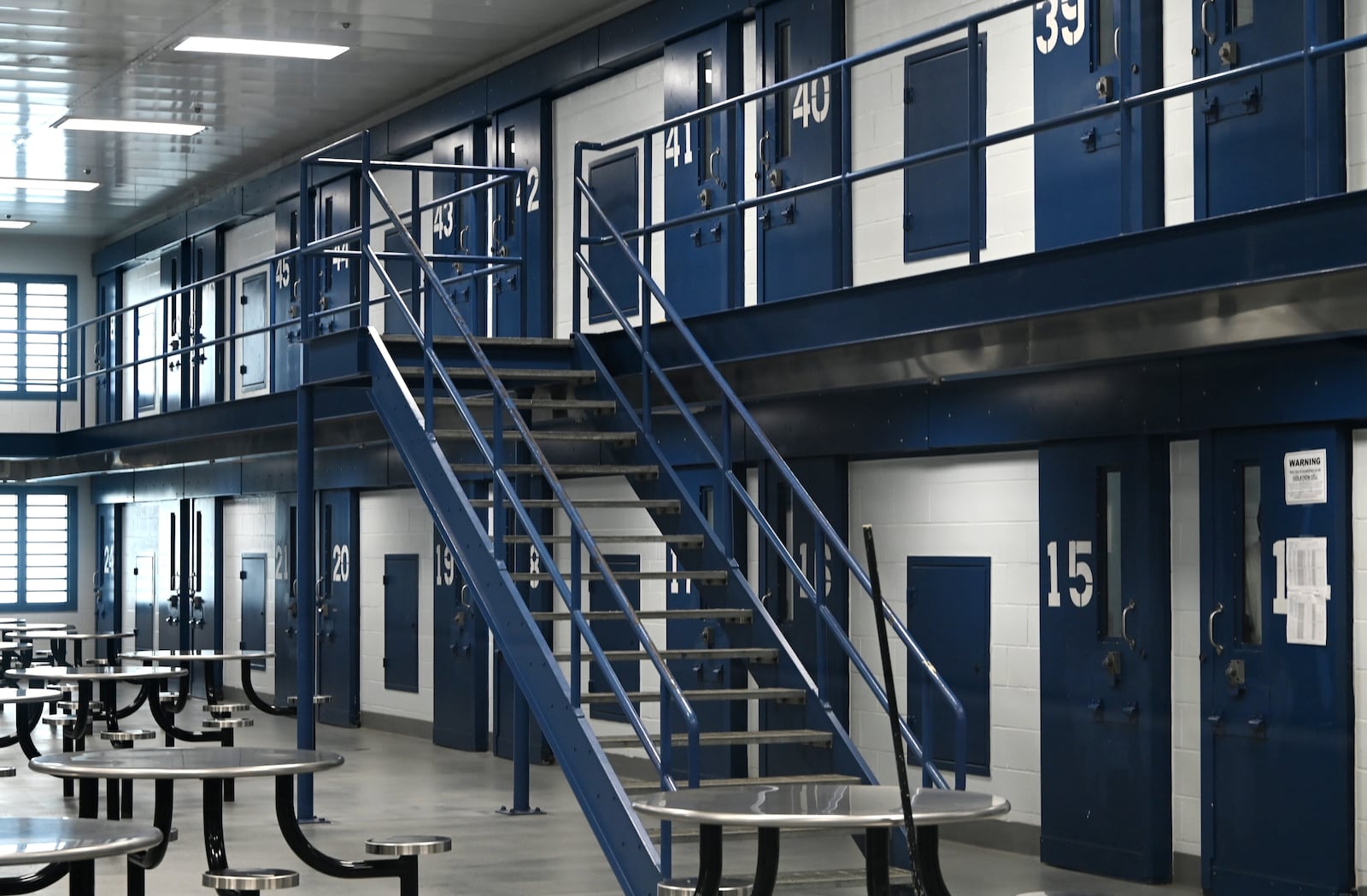 Butler County Sheriff Richard Jones has taken a hard stance on immigration since taking office more than two decades ago. He had 10 deputies credentialed to serve as ICE agents in the county, and said he plans to have more deputies eventually go through the training. Pictured is one of the nine pods in the Butler County Jail on Wednesday, July 9, 2025, on Hanover Street. MICHAEL D. PITMAN/STAFF