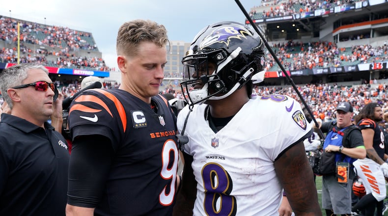 Cincinnati Bengals quarterback Joe Burrow (9) and Baltimore Ravens quarterback Lamar Jackson (8) talk following an NFL football game Sunday, Sept. 17, 2023, in Cincinnati. The Ravens won 27-24. (AP Photo/Jeff Dean)