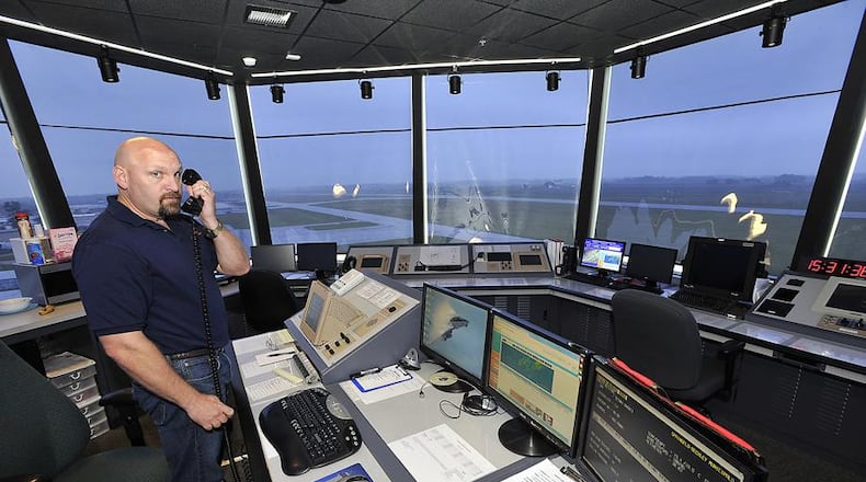 Bill Masseth, an air traffic controller at Springfield Beckley Municipal Airport, at work in the airport’s traffic control tower in 2013. Bill Lackey/Staff