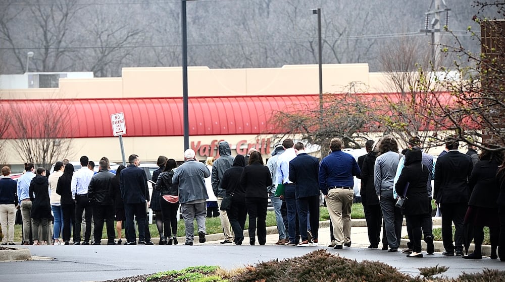 Jobseekers line up outside the Holiday Inn in Fairborn on Wednesday, March 22, 2023, for a one-day Air Force Life Cycle Management Center hiring event. AFLCMC is having an "invitation-only," hiring event for about 1,000 openings at Wright-Patterson Air Force Base through its website. FILE / STAFF