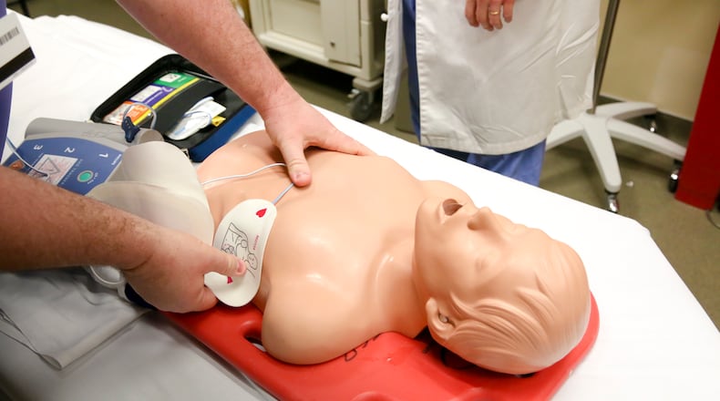 An AED (Automated External Defibrillator) is demonstrated at West Chester Hospital, Wednesday, Feb. 11, 2015. West Chester Hospital’s Emergency Department is now training EMS staff on “High Performance CPR”, and hopes to create a CPR clinic in the future. GREG LYNCH / STAFF