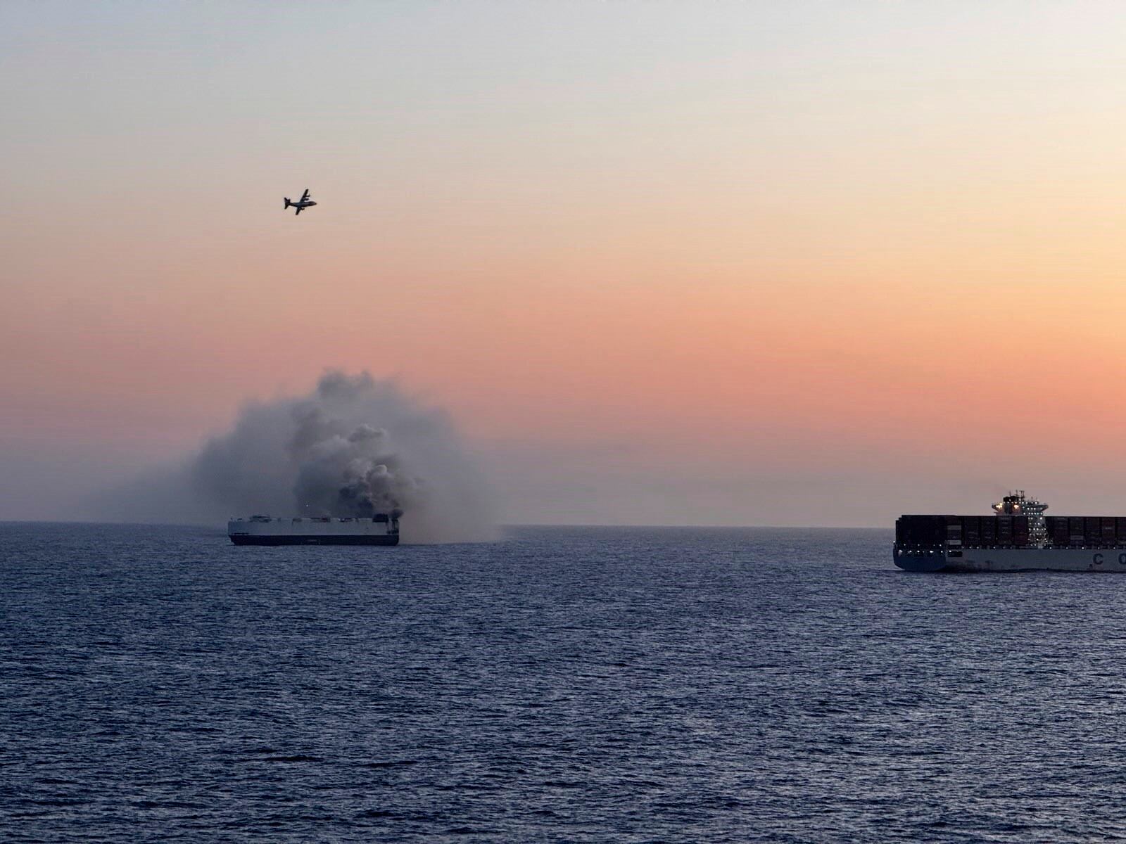 In this photo provided by the U.S. Coast Guard, smoke rises from the cargo vessel Morning Midas approximately 300 miles south of Adak, Alaska, June 3, 2025, as the crew of the cargo ship carrying about 3,000 vehicles to Mexico, abandoned ship after they could not control a fire. (U.S. Coast Guard/Courtesy of Air Station Kodiak via AP)