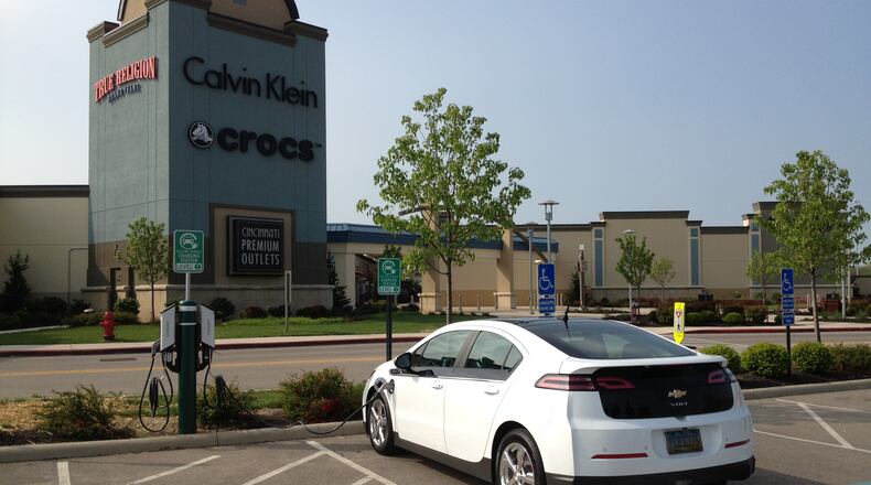A shopper’s Chevrolet Volt recharges at the Cincinnati Premium Outlets station in this 2012 file photo. CONTRIBUTED