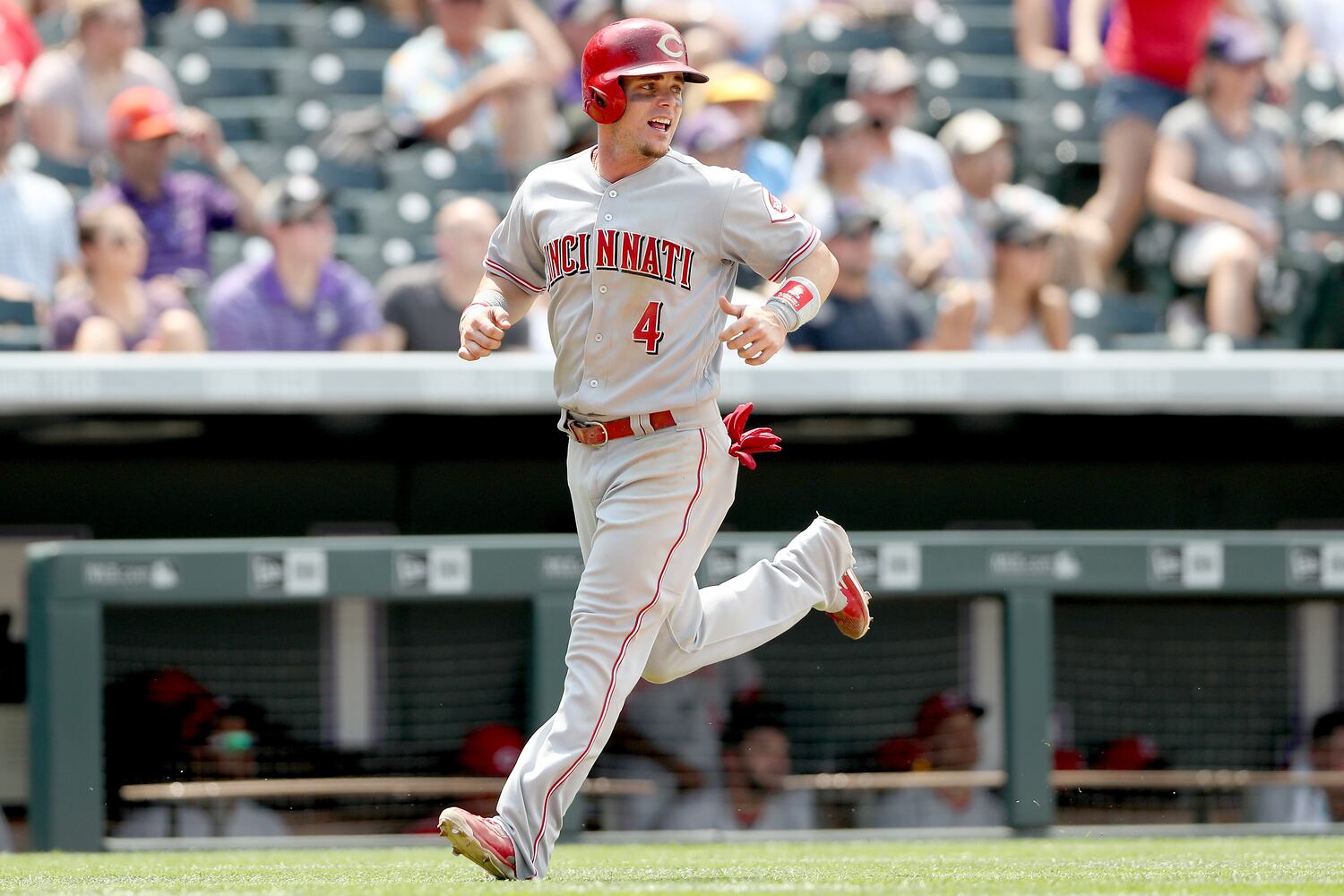 PHOTOS: Reds pile up 13 hits, beat the Rockies