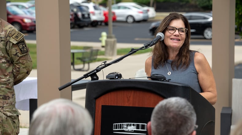 Tricia English, widow of Capt. Shawn English, speaks during the dedication of the champions garden named in honor of her husband outside the Veteran and Military Center at Wright State University. CHRIS SNYDER/WRIGHT STATE UNIVERSITY