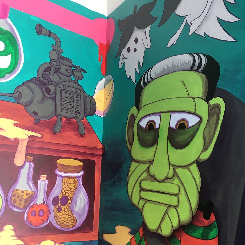 PHOTOS: Wild and wacky murals take over new restaurant at The Greene