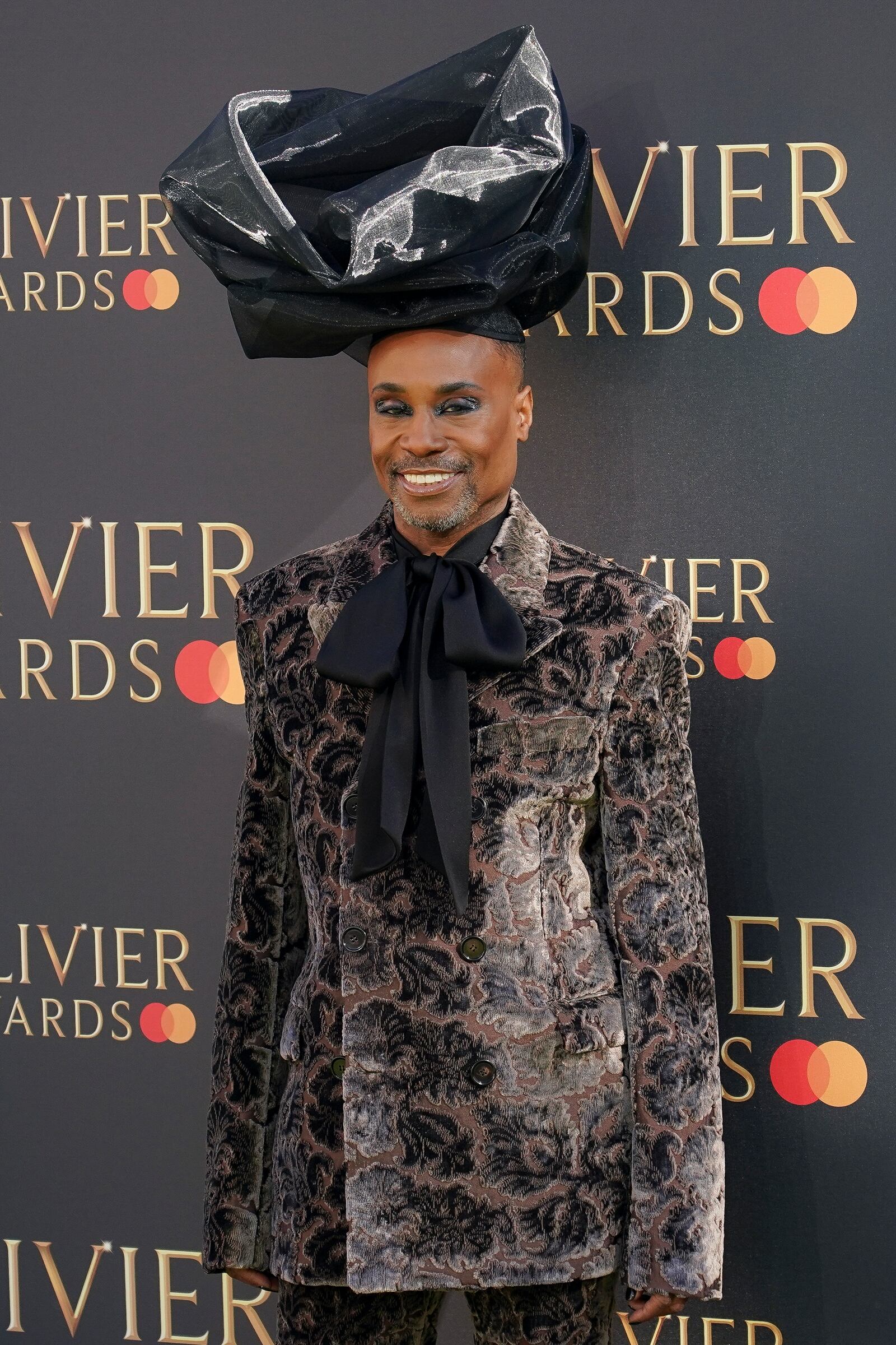 Billy Porter poses for photographers upon arrival at the Olivier Awards on Sunday, April 6, 2025, in London. (Photo by Alberto Pezzali/Invision/AP)