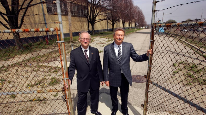 In this 2008 file photo, John Prikkel, president of Liteflex, and Ray Blatz, the company’s chief financial officer, stand near a former Delphi/Inland plant on Maywood Avenue in Dayton. Prikkel owns Liteflex, which makes composite-material vehicle leaf springs. With a grant from the city of Dayton, the company intended (at the time this photo was taken) to move molding work into the Maywood building. Prikkel said Thursday that he has sold Liteflex to Hendrickson International. FILE