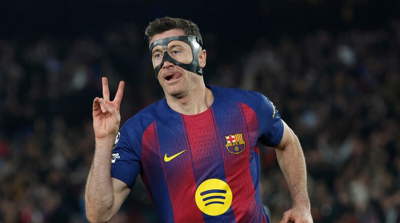 Barcelona's Robert Lewandowski celebrates after scoring his side's sixth goal during the Champions League round of 16, second leg soccer match between FC Barcelona and Newcastle United FC in Barcelona, Spain, Wednesday, March 18, 2026. (AP Photo/Joan Monfort)