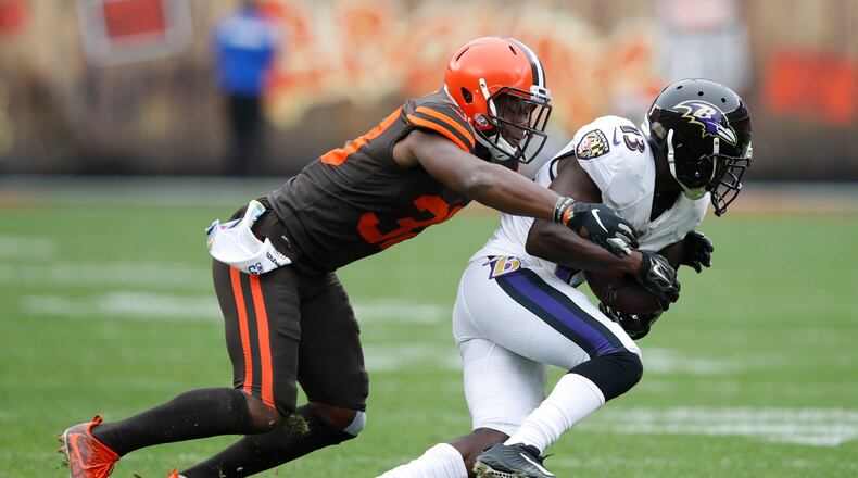 T.J. Carrie #38 of the Cleveland Browns tackles John Brown #13 of the Baltimore Ravens in the first half at FirstEnergy Stadium on October 7, 2018 in Cleveland, Ohio. (Photo by Joe Robbins/Getty Images)