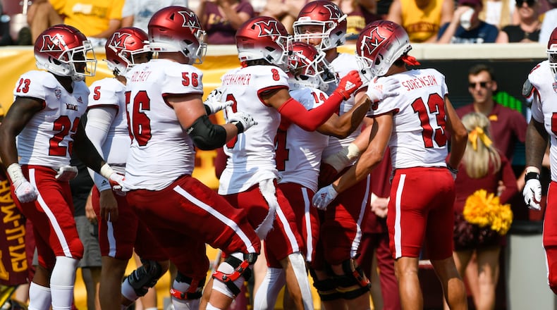 Miami-Ohio Wide Receiver Jack Sorenson (13) celebrates with his teammates after catching a 23-yard pass for a touchdown during the second half of an NCAA college football game against Minnesota, Saturday, Sept. 11, 2021, in Minneapolis. Minnesota won 31-26. (AP Photo/Craig Lassig)