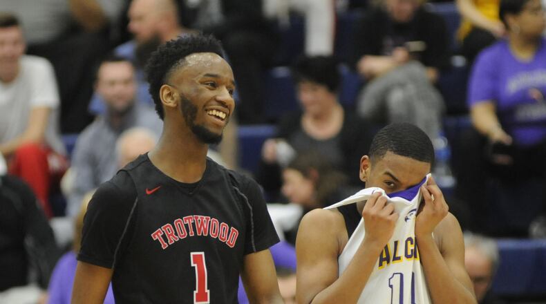 Amari Davis of Trotwood (left) had 23 points. Trotwood-Madison defeated Cin. Aiken 96-62 in a boys high school basketball D-II regional semifinal at Trent Arena on Thursday, March 14, 2019. MARC PENDLETON / STAFF