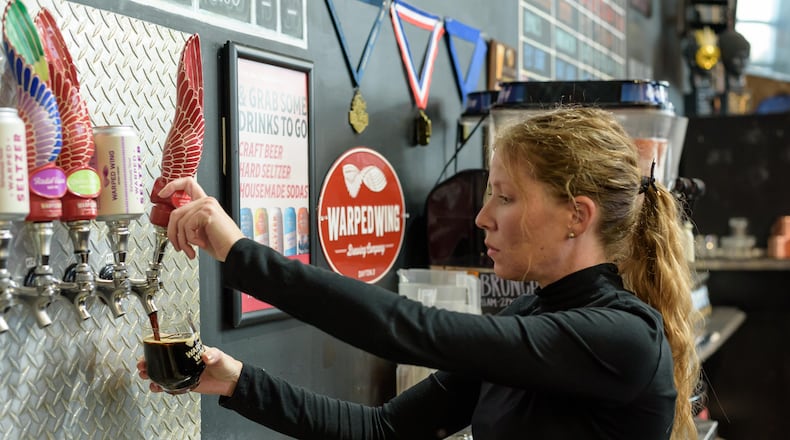 Warped Wing Brewing Company hosted their 10th annual Esther's Li'l Secret Launch Party & Reveal at the brewery's downtown Dayton taproom on Thursday, Nov. 2, 2023. TOM GILLIAM/CONTRIBUTING PHOTOGRAPHER