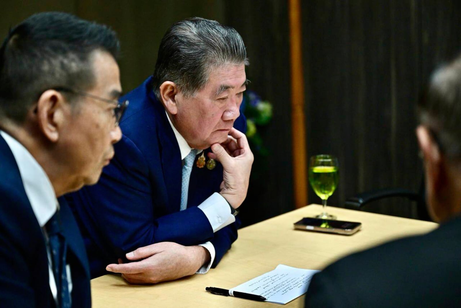 This image provided by the Thai Prime MInister's Office shows Thailand's Acting Prime Minister Phumtham Wechayachai, center, with his staff listening during his phone call with U.S. President Donald Trump, in Bangkok on Monday July 28, 2025, after returning from Malaysia, where he met Cambodian Prime Minister Hun Manet for peace talks which resulted in a ceasefire in the two nations' five days of fighting along their border over a territorial dispute. (Thai Prime MInister's Office via AP)