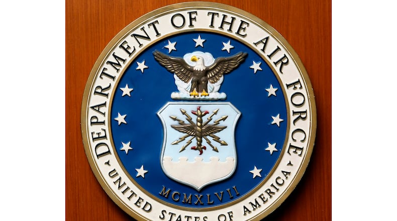 FILE - This Friday, Aug. 10, 2007, file photo, shows the logo of the Department of the U.S. Air Force at the United Staes embassy, in Berlin. A new report issued Monday, Dec. 21, 2020, on racial disparities in the Air Force concludes that Black service members in the service are far more likely to be investigated, arrested, face disciplinary actions, and be discharged for misconduct. (AP Photo/Michael Sohn, File)