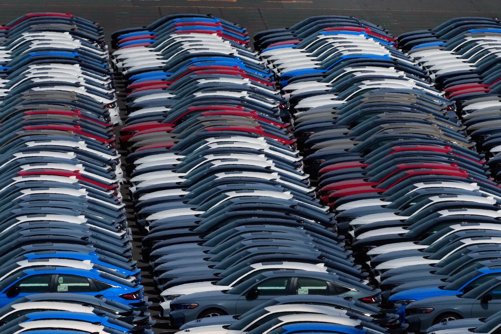 Export vehicles are parked at Daikoku Pier in Yokohama, near Tokyo, Tuesday, April 8, 2025. (AP Photo/Hiro Komae)