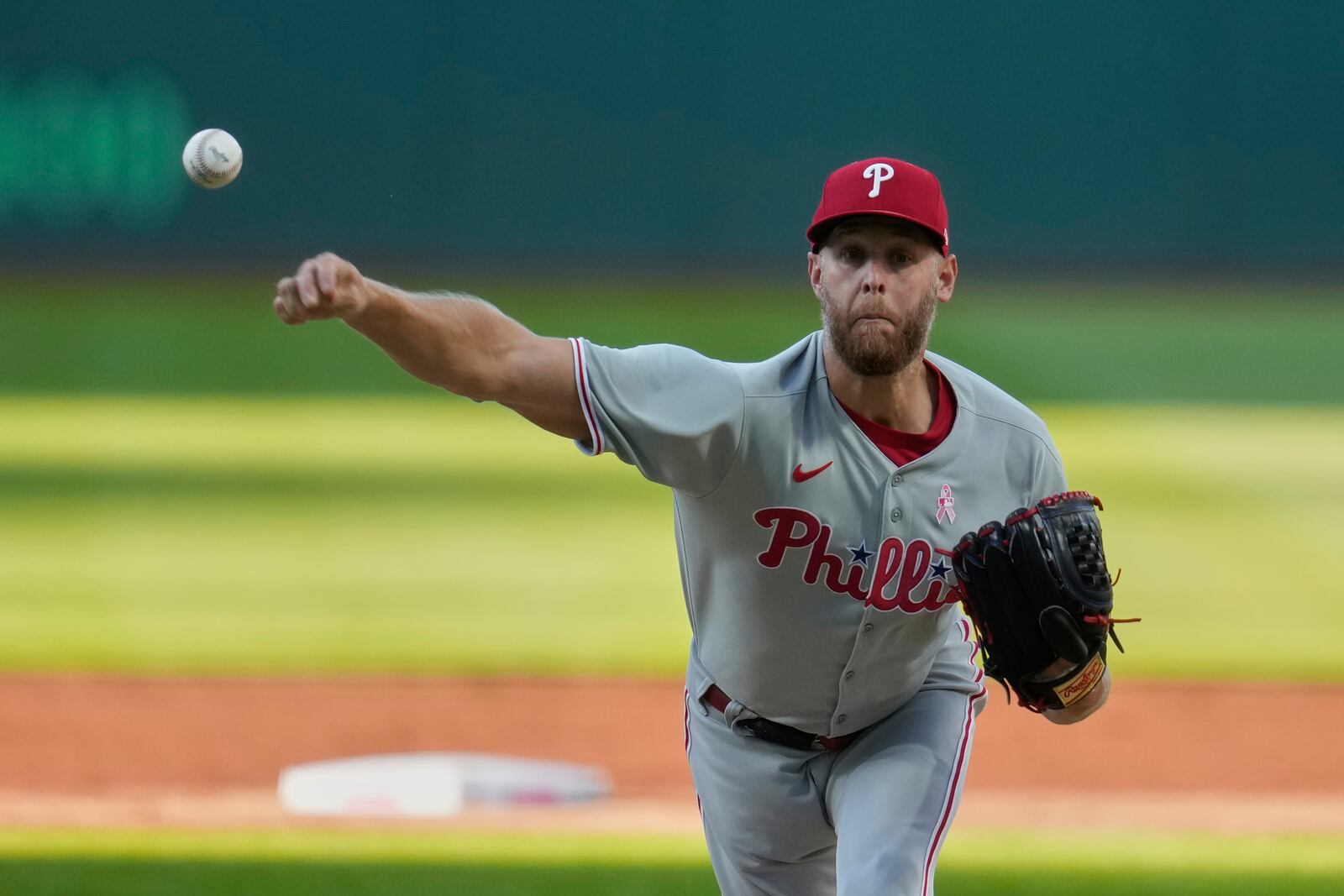 Philadelphia Phillies starting pitcher Zack Wheeler pitches in the first inning of a baseball game against the Cleveland Guardians in Cleveland, Sunday, May 11, 2025. (AP Photo/Sue Ogrocki)