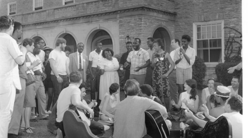 Volunteers sing freedom songs on the lawn in front of Clawson Hall at Western College (now Miami University) in 1964. Miami will be hosting additional events next week to commemorate the historic summer. George R. Hoxie/Smith Library of Regional History