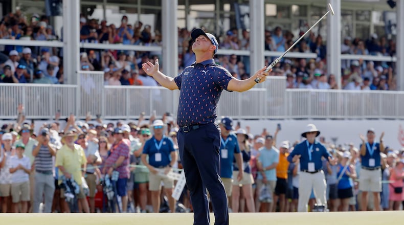 Gary Woodland celebrates after sinking his final putt on the 18th green to win the Texas Children's Houston Open golf tournament Sunday, March 29, 2026, in Houston. (AP Photo/Michael Wyke)