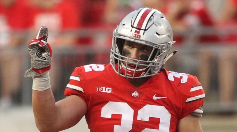 Ohio State’s Tuf Borland celebrates a stop against Army on Saturday, Sept. 16, 2017, at Ohio Stadium in Columbus. David Jablonski/Staff