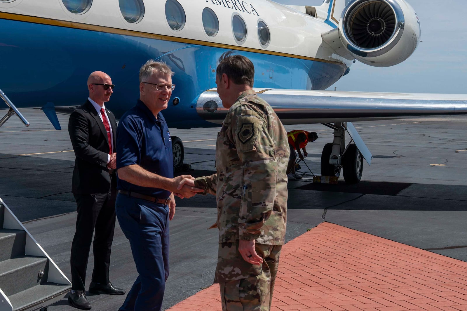 Secretary of the Air Force Troy Meink shakes hands with U.S. Air Force Gen. Kevin Schneider, Pacific Air Forces commander, on Joint Base Pearl Harbor-Hickam, Hawaii, July 24, 2025.  M(U.S. Air Force photo by Senior Airman Mark Sulaica)