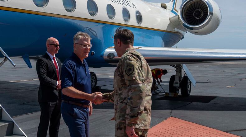 Secretary of the Air Force Troy Meink shakes hands with U.S. Air Force Gen. Kevin Schneider, Pacific Air Forces commander, on Joint Base Pearl Harbor-Hickam, Hawaii, July 24, 2025. M(U.S. Air Force photo by Senior Airman Mark Sulaica)