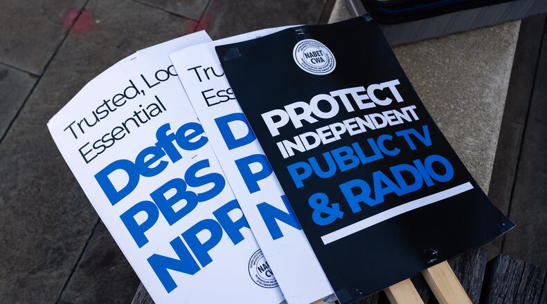FILE — Signs supporting NPR outside its headquarters in Washington on March 26, 2025. The Trump administration has accused NPR and PBS of using public funds to produce biased coverage and “left-wing propaganda.”  (Eric Lee/The New York Times)