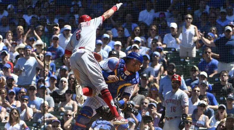 CHICAGO, IL - JULY 08: Billy Hamilton #6 of the Cincinnati Reds is safe at home as Willson Contreras #40 of the Chicago Cubs can’t handle the throw during the fifth inning on July 8, 2018 at Wrigley Field in Chicago, Illinois. (Photo by David Banks/Getty Images)