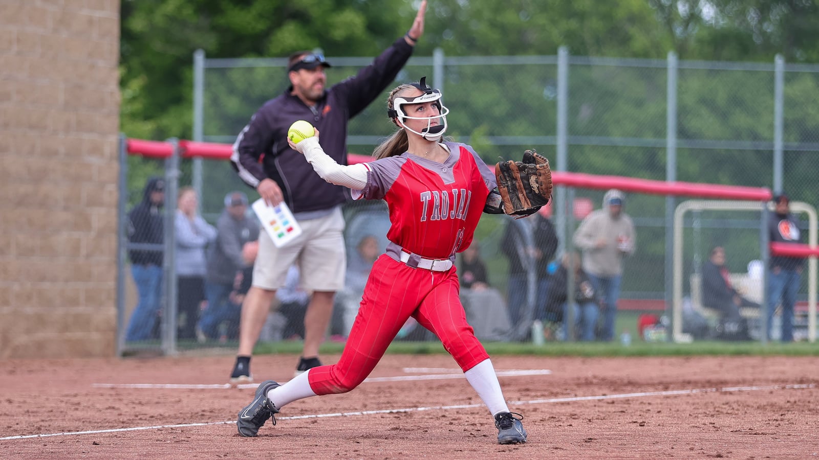 Southeastern High School junior third baseman Addi Vanover throws the ball to first base during their Division VII district final game against Bradford on Thursday night at Houston High School. The Trojans won 7-5. MICHAEL COOPER / STAFF