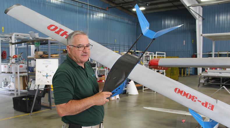 Frank Beafore, executive director at SelectTech Geospatial, in Springfield holds a EP-3000 drone. The Air Force Material Command at Wright-Patterson Air Force Base spent more than $13.9 million with his firm during fiscal year 2016. JEFF GUERINI/STAFF