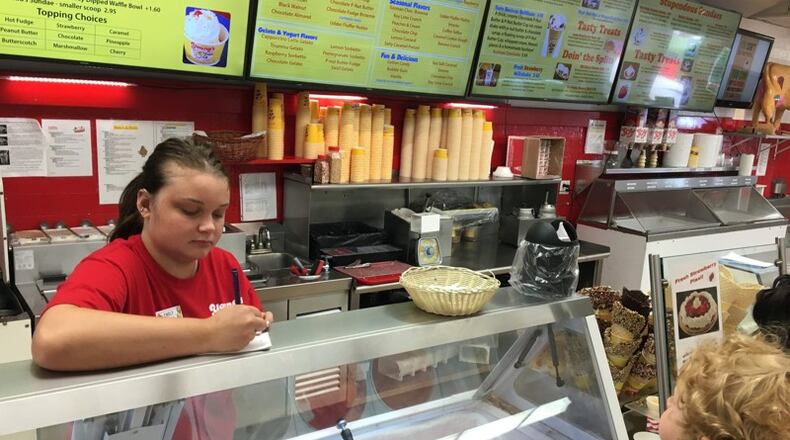 Emily Dyer of Springfield takes a customer order at Young’s Jersey Dairy. KARA DRISCOLL/STAFF