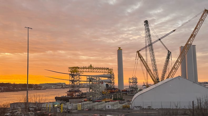 FILE - Blades and turbine bases for offshore wind sit at a staging area at New London State Pier, Jan. 14, 2026, in New London, Conn. (AP Photo/Matt O'Brien, File)