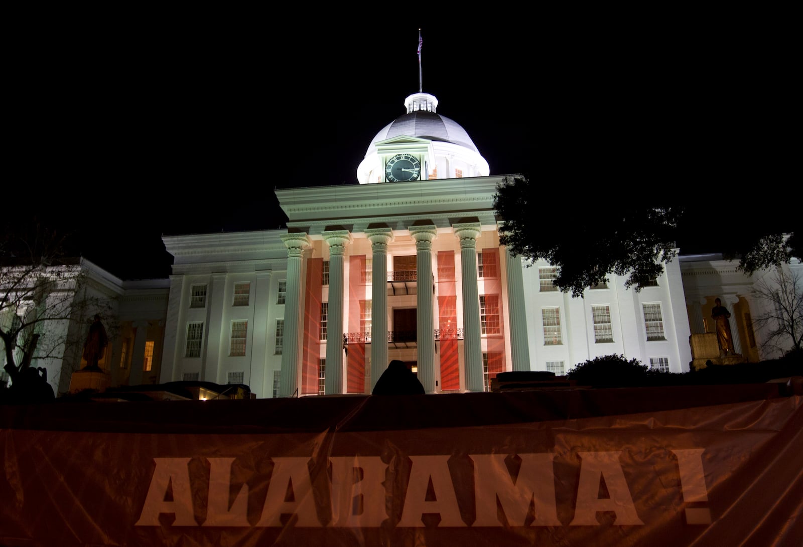 FILE - Festive banners and bunting hang from and around the Alabama Capitol early Jan. 16, 2011. (AP Photo/Dave Martin, File)