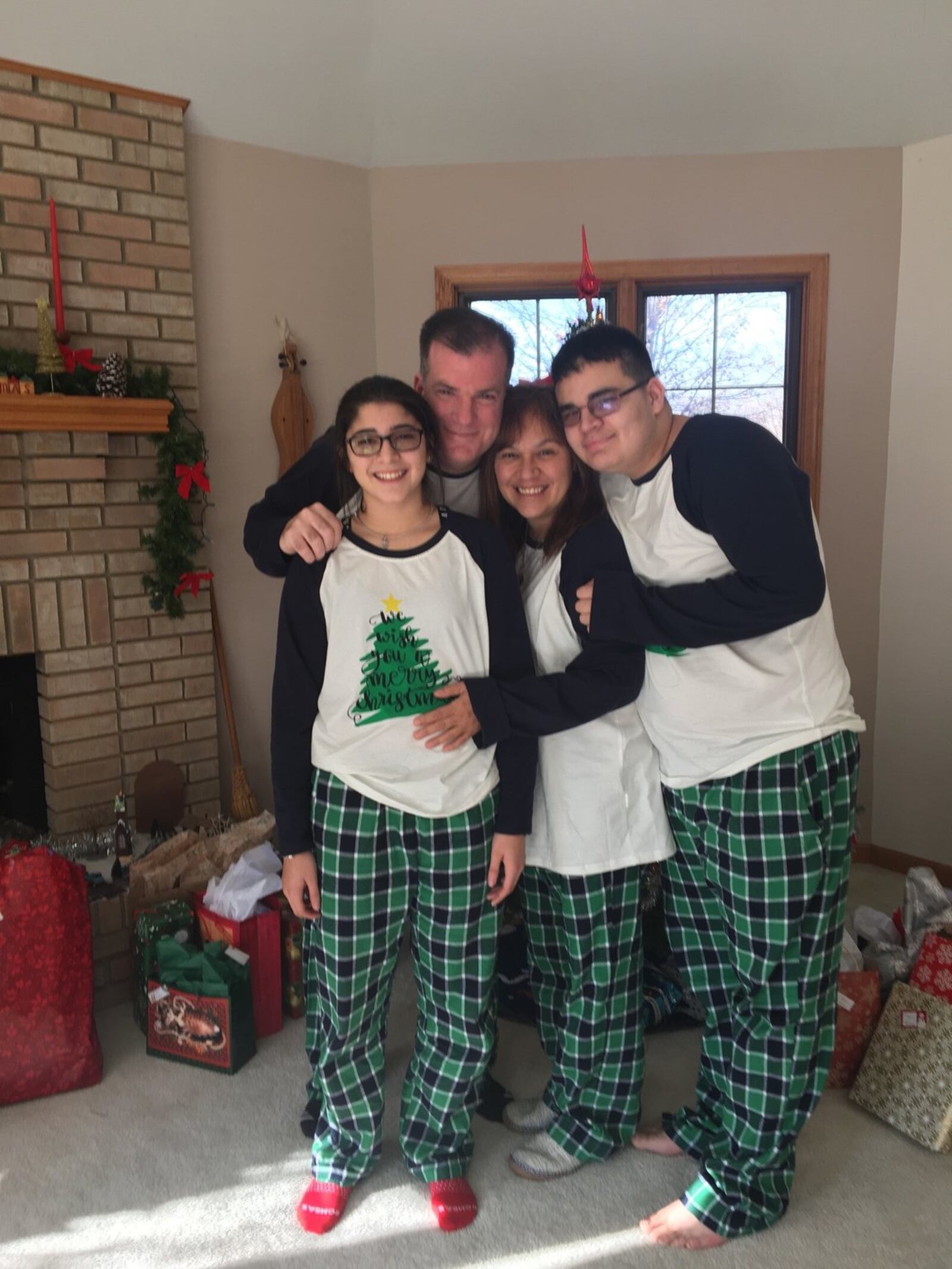 The Martin family in matching Christmas pajamas. From left, daughter Emma, Chuck, Dulcie and son Max. CONTRIBUTED