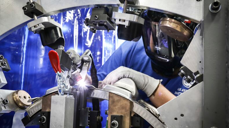 An aerospace welder at work on a jet engine component at GE Aviation subsidiary Unison in Beavercreek. Contributed