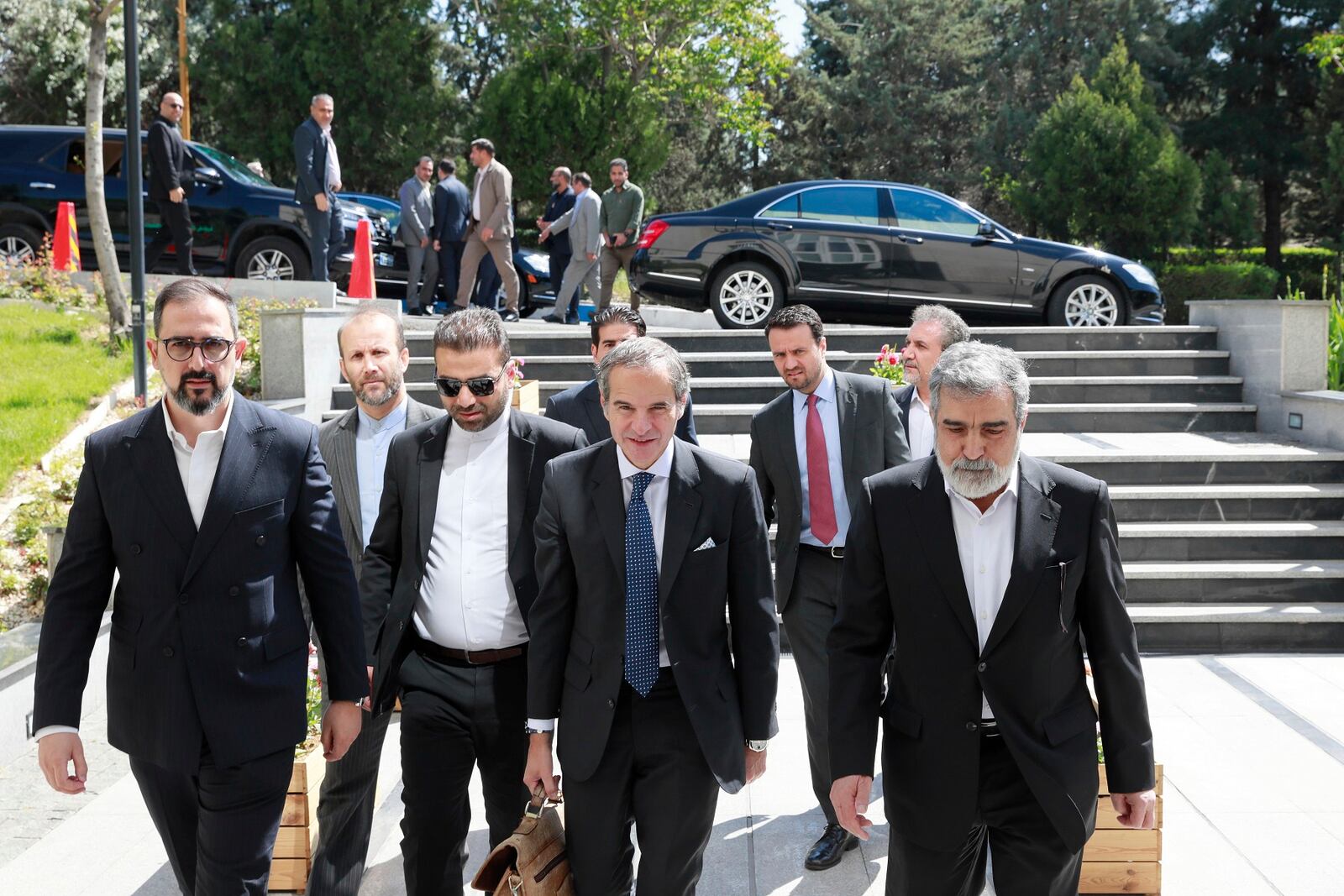 In this photo, released by the Atomic Energy Organisation of Iran, International Atomic Energy Agency (IAEA) Director General, Rafael Mariano Grossi, front center, arrives at Atomic Energy Organisation of Iran, in Tehran, Iran, Thursday, April 17, 2025. (Atomic Energy Organisation of Iran via AP)
