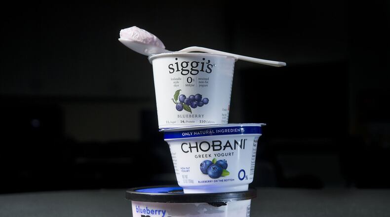 Three different yogurt products in studio in Sacramento on Thursday, Feb. 12, 2015. A recent study suggests yogurt could help lower risk of cardiovascular disease in adults who have high blood pressure. (Randall Benton/Sacramento Bee/TNS)