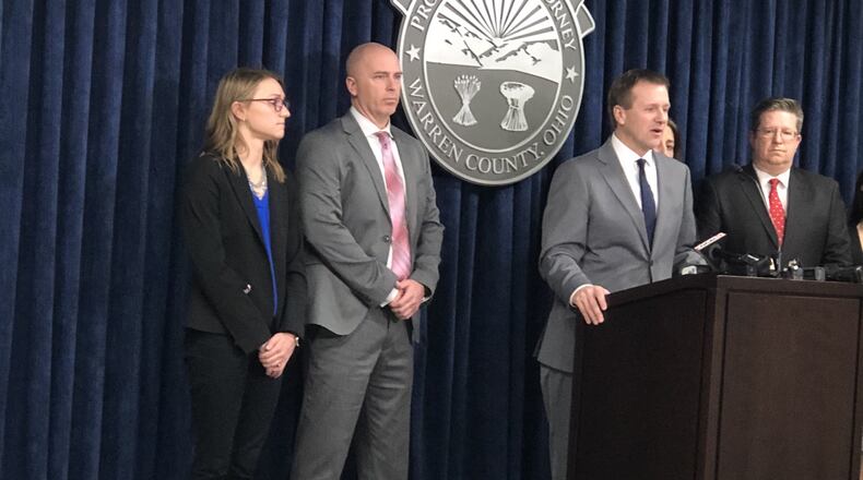 Witness Advocate Erika Morgan, Springboro Detective Terry Dunkel, Warren County Prosecutor David Fornshell and Julie Kraft and Kevin Hardman, the prosecutors on the John Austin Hopkins case, during a press conference after the verdict was announced. STAFF/LAWRENCE BUDD