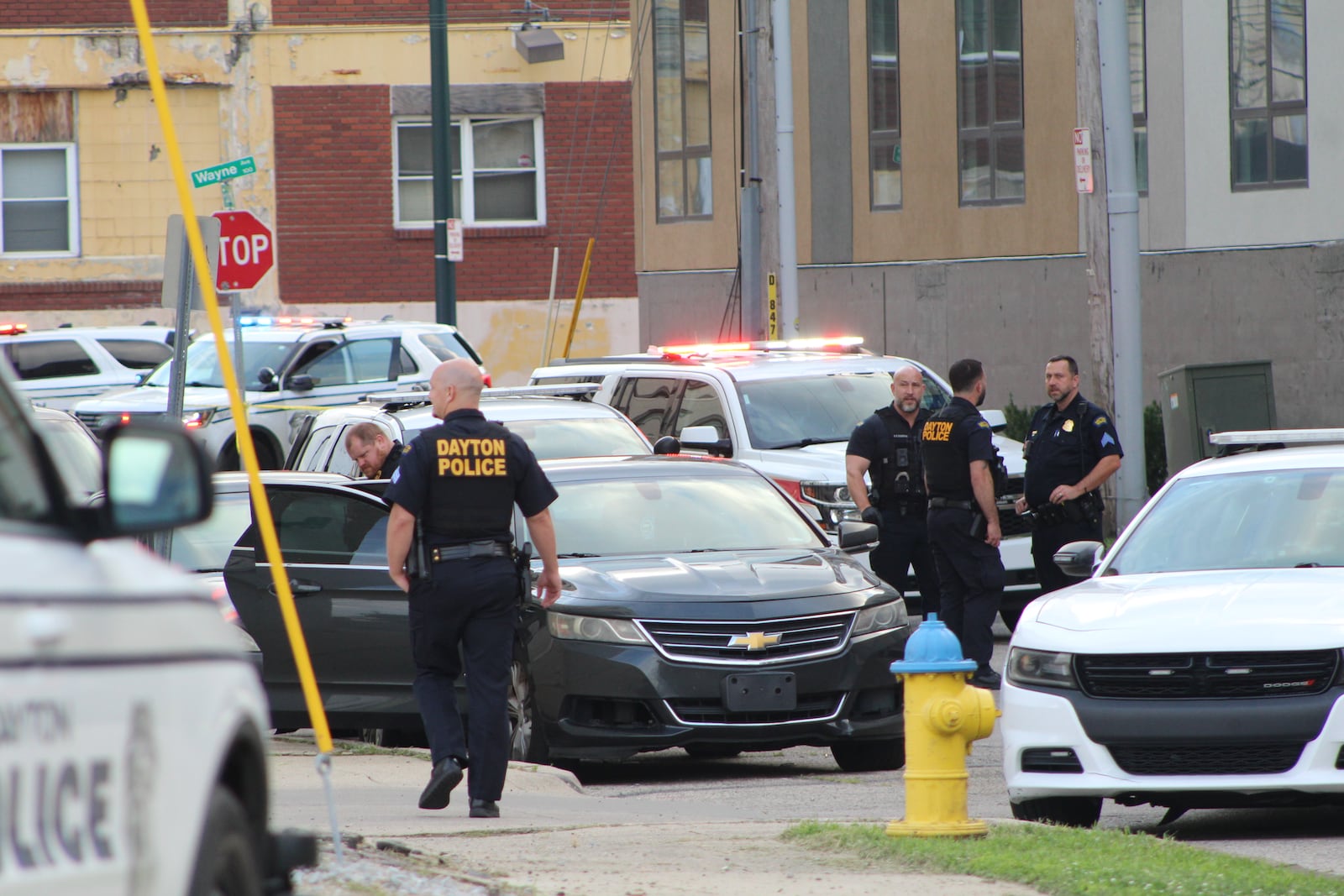 Dayton police officers responded to a scene on East Fourth Street, near Wayne Avenue in downtown Dayton. Officers went through a car that was parked in front of the 503 apartments. CORNELIUS FROLIK / STAFF
