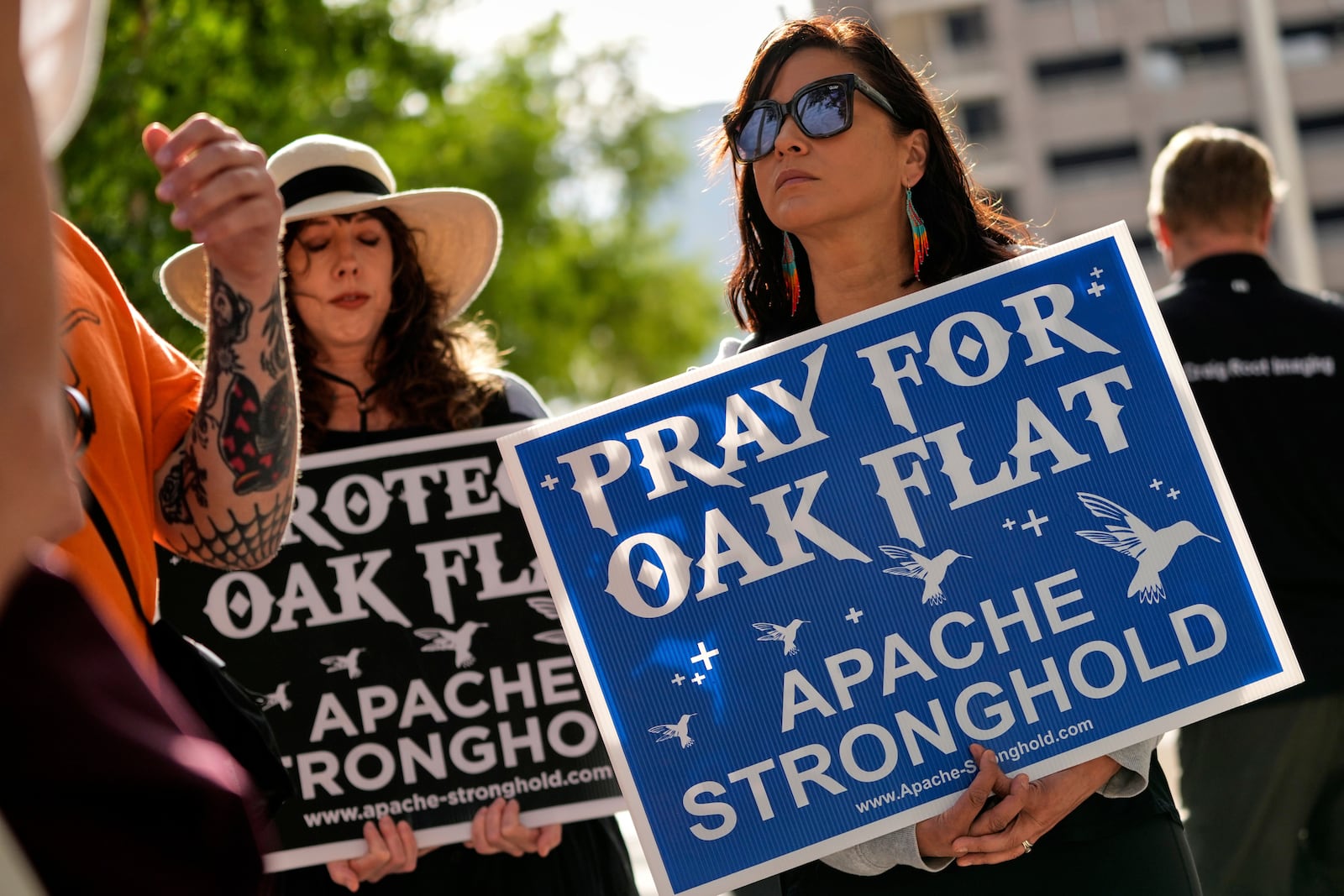 FILE - Members of Apache and others who want to halt a massive copper mining project on federal land in Arizona gather outside the U.S. District Court, May 7, 2025, in Phoenix. (AP Photo/Matt York, File)