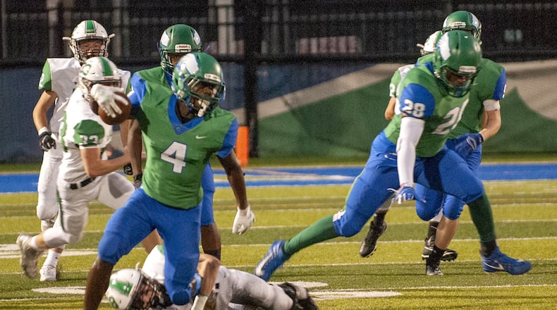Chaminade Julienne receiver Kenyon Owens breaks a tackle against Hamilton Badin in a 2019 game. Jeff Gilbert/CONTRIUBUTED